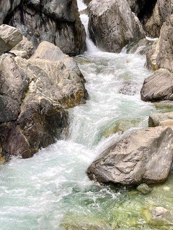 A stormy stream of a mountain river flowing among the rocks