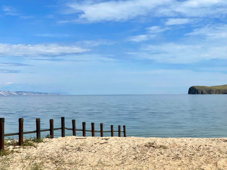 Wooden fence on the beach, Olkhon Island, Baikal, Russia.の写真素材
