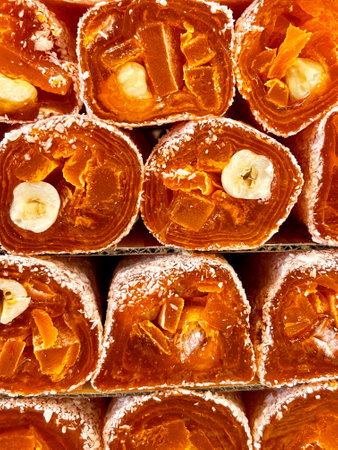 Traditional Turkish sweets, slices of orange delight close up viewの写真素材