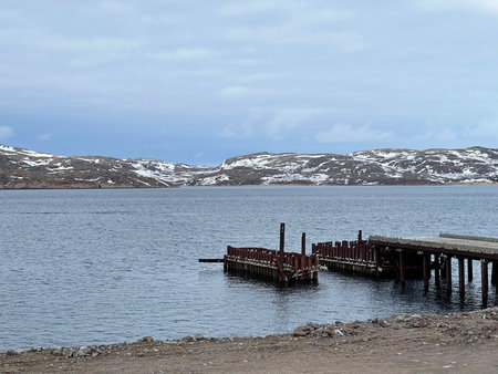 Old abandoned wooden pier on the Barents Sea coast, Teriberka, Russiaの写真素材