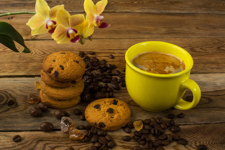 Coffee cup, cookies and yellow  orchid. Cup of coffee. Coffee break. Morning coffee. Coffee cupの写真素材