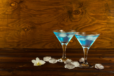 Blue curacao liqueur cocktail in a martini glasses. Blue cocktail. Blue margarita. Blue Hawaiian cocktail. Blue curacao liqueur.  Blue Martiniの写真素材