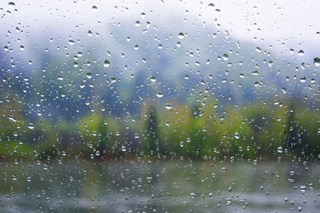 River view through window in rainy day. Rainy day. Rain drops. Rain drops background.