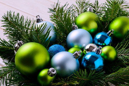 Christmas background with blue and green ornaments. Christmas party decoration with shiny balls.の写真素材