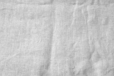 Crumpled linen fabric background. Black and white burlap canvas texture template for overlay artwork.の写真素材