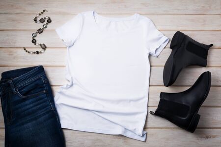 White womenâs cotton T-shirt mockup with chelsea boots and gray necklace. Design t shirt template, tee print presentation mock upの写真素材
