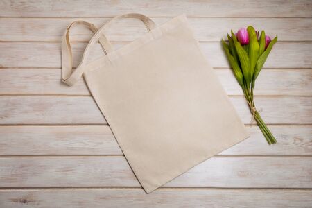 Canvas tote bag mockup with pink tulips. Empty tote bag mock up for branding presentation. の写真素材