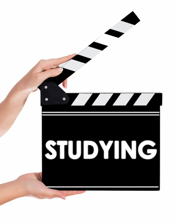 Hands holding a clapper board.Isolated on white backroundの写真素材