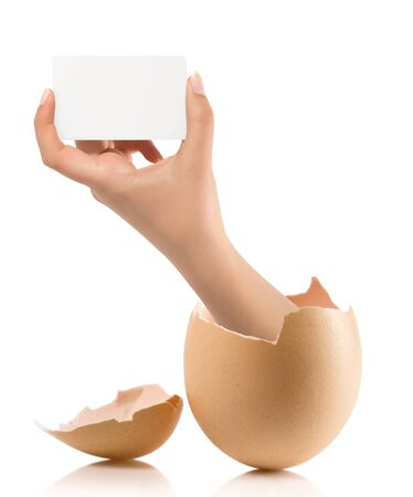 Hand with broken egg isolated on white backroundの写真素材