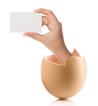 Hand with broken egg isolated on white backroundの写真素材