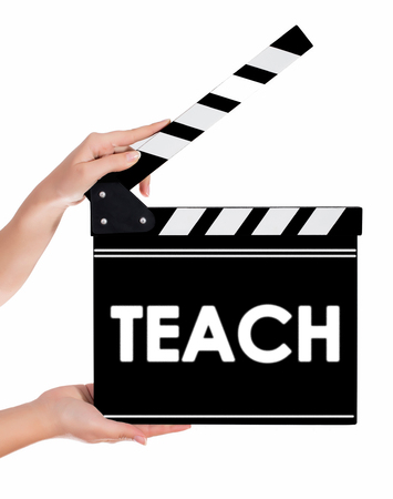Hands holding a clapper board.Isolated on white backroundの写真素材