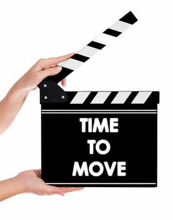 Hands holding a clapper board.Isolated on white backroundの写真素材
