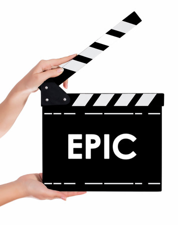 Hands holding a clapper board.Isolated on white backroundの写真素材