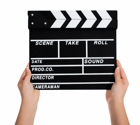 Hands holding a clapper board.Isolated on white backroundの写真素材