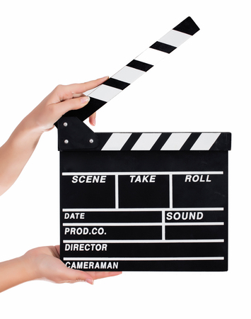 Hands holding a clapper board.Isolated on white backroundの写真素材