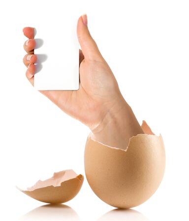 Hand with broken egg isolated on white backroundの写真素材