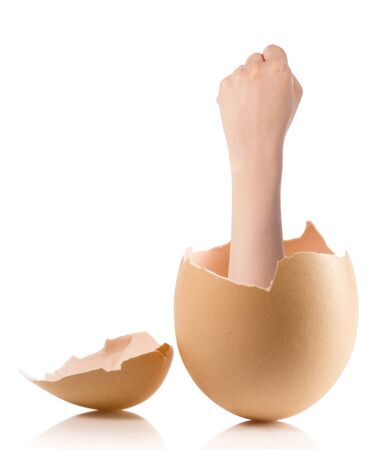 Hand with broken egg isolated on white backroundの写真素材