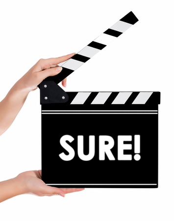 Hands holding a clapper board.Isolated on white backroundの写真素材