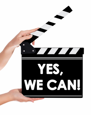 Hands holding a clapper board.Isolated on white backroundの写真素材