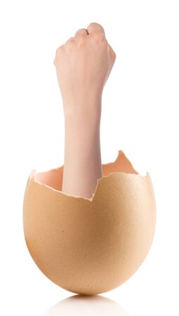 Hand with broken egg isolated on white backroundの写真素材
