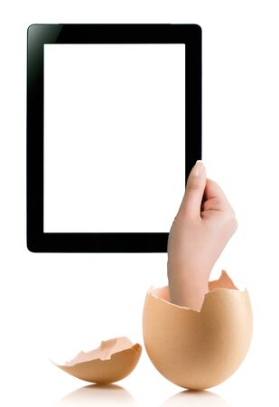 Hand holding a tablet computer with white screen. Hand with broken egg isolated on white backround. Hand holding tablet pc isolated on white background with blank screen.の写真素材