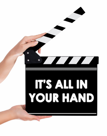 Hands holding a clapper board.Isolated on white backroundの写真素材