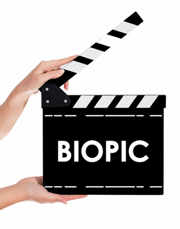 Hands holding a clapper board.Isolated on white backroundの写真素材
