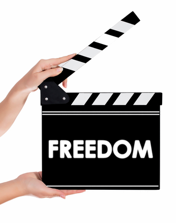 Hands holding a clapper board.Isolated on white backroundの写真素材