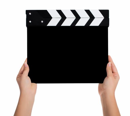 Hands holding a clapper board.Isolated on white backroundの写真素材