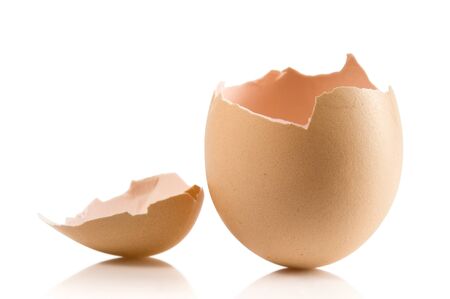 Hand with broken egg isolated on white backroundの写真素材