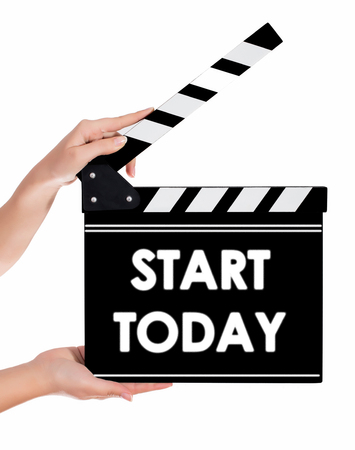 Hands holding a clapper board.Isolated on white backroundの写真素材