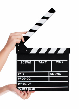 Hands holding a clapper board.Isolated on white backroundの写真素材
