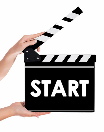 Hands holding a clapper board.Isolated on white backroundの写真素材
