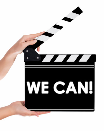 Hands holding a clapper board.Isolated on white backroundの写真素材