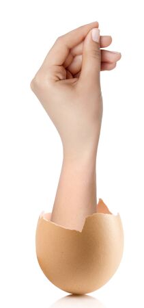 Hand with broken egg isolated on white backroundの写真素材