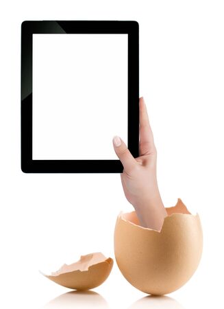 Hand holding a tablet computer with white screen. Hand with broken egg isolated on white backround. Hand holding tablet pc isolated on white background with blank screen.の写真素材