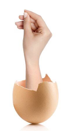 Hand with broken egg isolated on white backroundの写真素材
