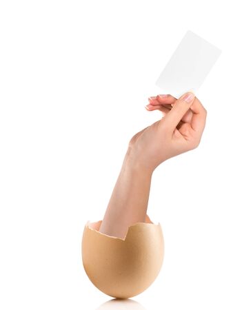 Hand with broken egg isolated on white backroundの写真素材