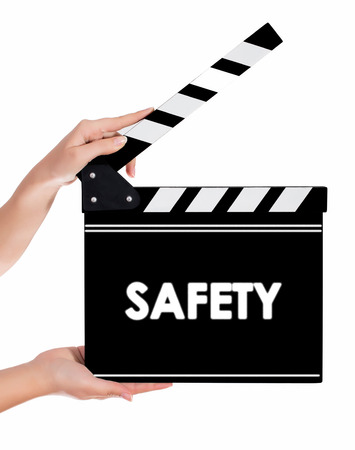 Hands holding a clapper board.Isolated on white backroundの写真素材