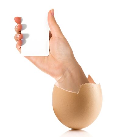 Hand with broken egg isolated on white backroundの写真素材