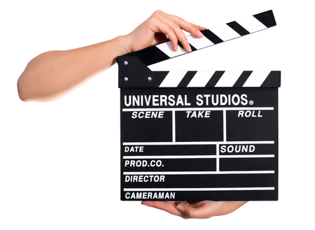 Hands holding a clapper board.Isolated on white backroundの写真素材