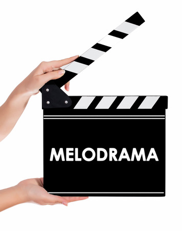 Hands holding a clapper board.Isolated on white backroundの写真素材