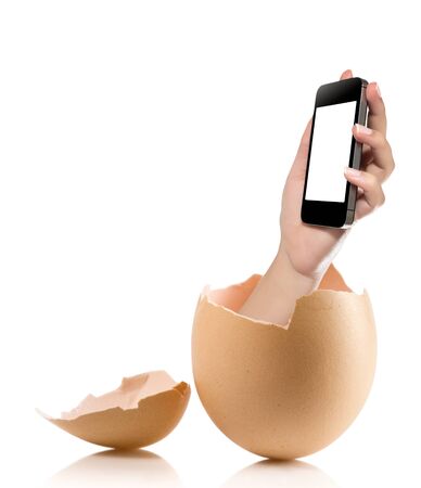 Hand with broken egg isolated on white backround. Hand of young man holding smart phone white screen isolated on white background with clipping pathの写真素材