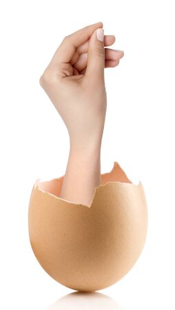 Hand with broken egg isolated on white backroundの写真素材