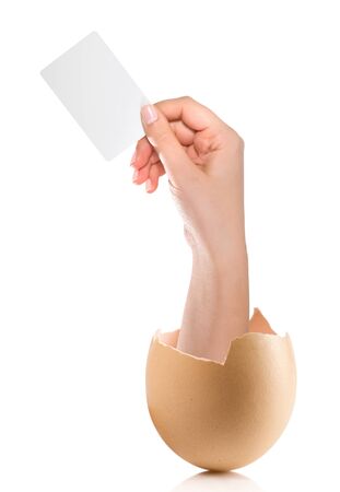 Hand with broken egg isolated on white backroundの写真素材