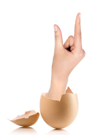 Hand with broken egg isolated on white backroundの写真素材
