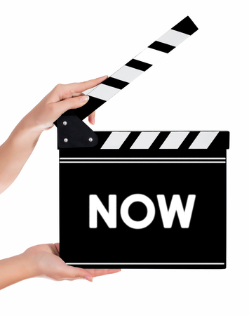 Hands holding a clapper board.Isolated on white backroundの写真素材