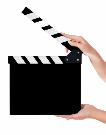 Hands holding a clapper board.Isolated on white backroundの写真素材
