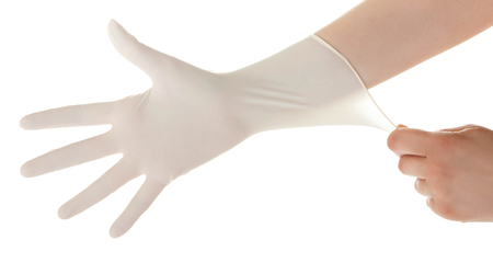 Doctor show hands with sterile gloves isolated on white. Medical advertising concept.の写真素材