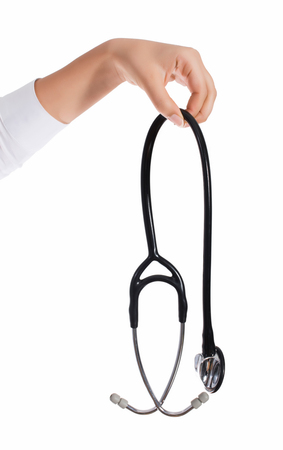 Doctor's hands holding stethoscope.Studio shot isolated on whiteの写真素材